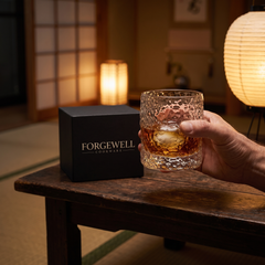 Textured crystal whisky glass in hand with Forgewell gift box