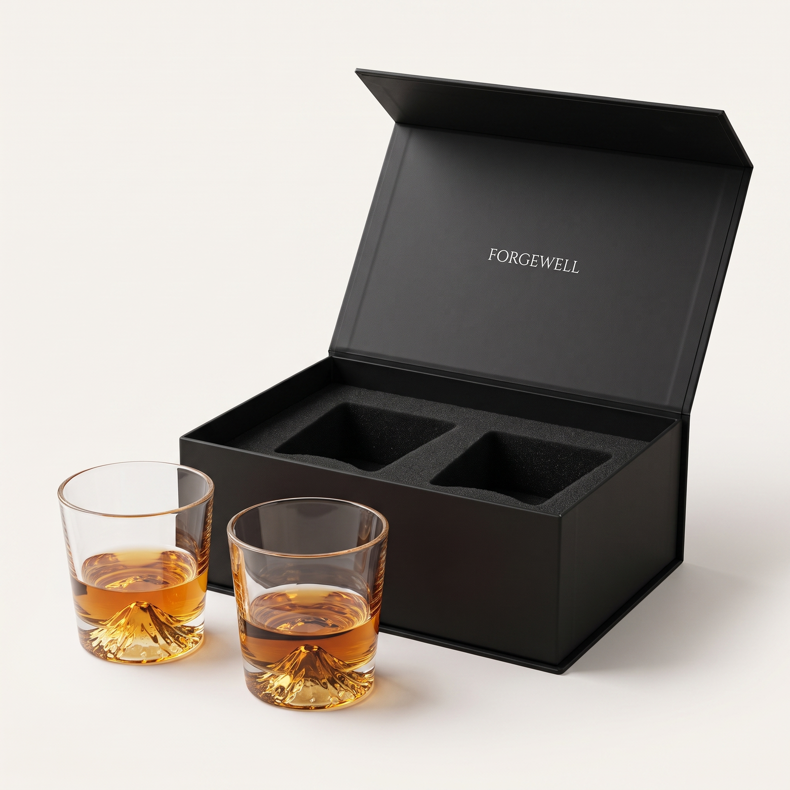 Two Mountain Peak whisky glasses with open Forgewell gift box