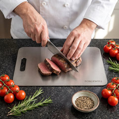 Slicing beef on the Forgewell titanium cutting board, top view